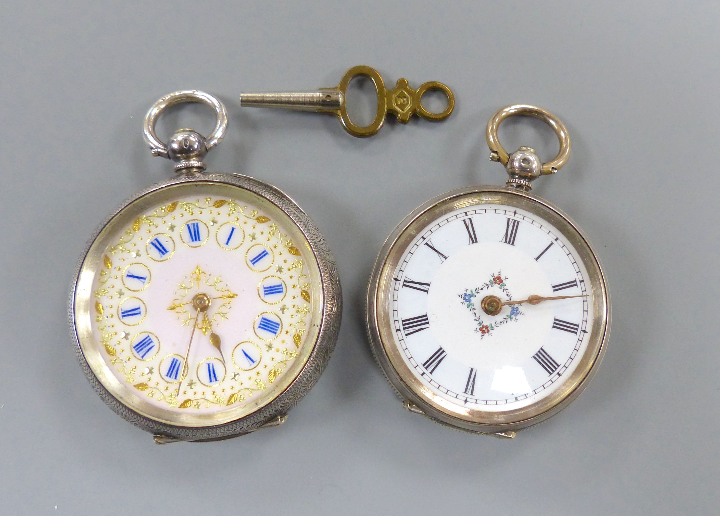 Two engraved silver open face pocket watches,